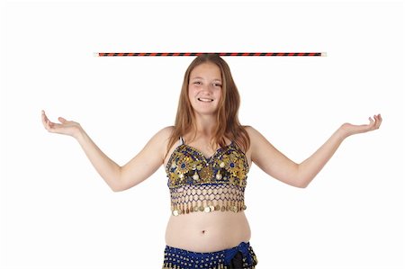 Young Caucasian belly dancing girl in beautiful decorated clothes on white background and reflective floor. Not isolated Foto de stock - Super Valor sin royalties y Suscripción, Código: 400-04623154