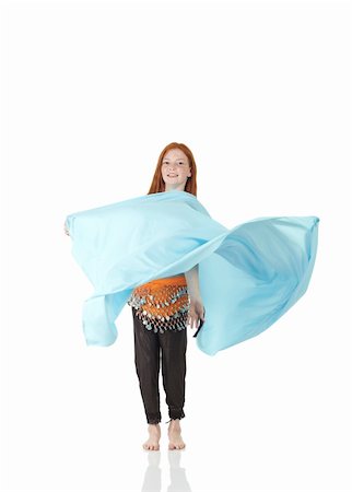 Young Caucasian belly dancing girl in beautiful decorated clothes on white background and reflective floor. Not isolated Stock Photo - Budget Royalty-Free & Subscription, Code: 400-04623151
