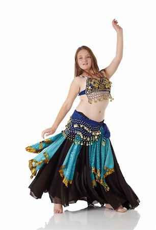 simsearch:400-05154700,k - Young Caucasian belly dancing girl in beautiful decorated clothes on white background and reflective floor. Not isolated Stock Photo - Budget Royalty-Free & Subscription, Code: 400-04623160
