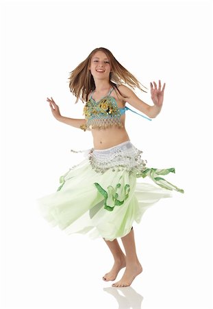 simsearch:400-05154700,k - Young Caucasian belly dancing girl in beautiful decorated clothes on white background and reflective floor. Not isolated Stock Photo - Budget Royalty-Free & Subscription, Code: 400-04623162