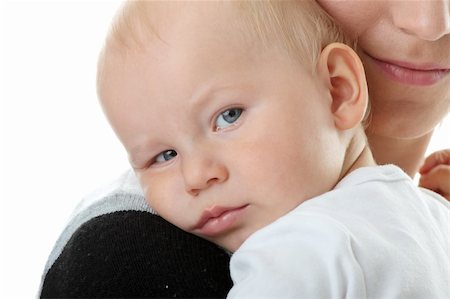 A mother and her tired cute baby boy isolated on white background Stock Photo - Budget Royalty-Free & Subscription, Code: 400-04623489