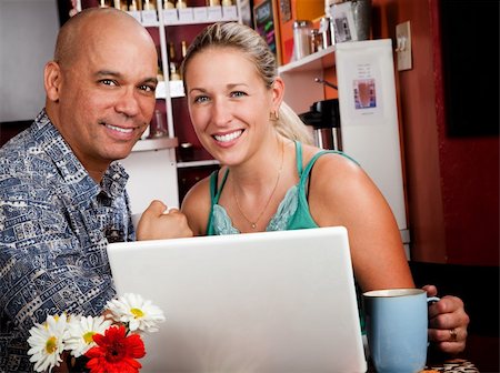 portraits of beautiful bald shaved women - Attractive couple in a coffee house with laptop computer Stock Photo - Budget Royalty-Free & Subscription, Code: 400-04634033
