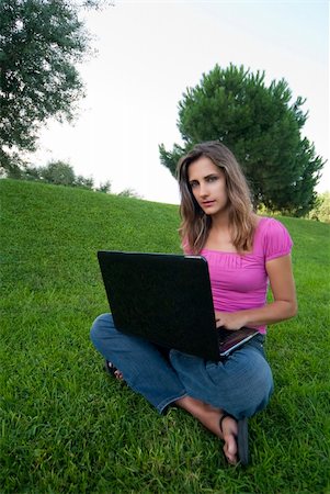simsearch:6109-06003526,k - Woman with laptop sit relaxed green grass Stock Photo - Budget Royalty-Free & Subscription, Code: 400-04634124