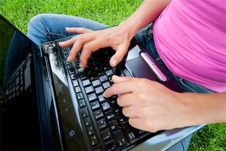 simsearch:6109-06003526,k - Woman with laptop sit relaxed green grass Stock Photo - Budget Royalty-Free & Subscription, Code: 400-04634125