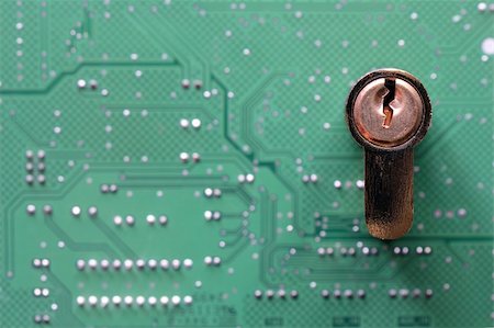 simsearch:400-03966982,k - A closeup of a green computer circuit board with lock Stock Photo - Budget Royalty-Free & Subscription, Code: 400-04634166
