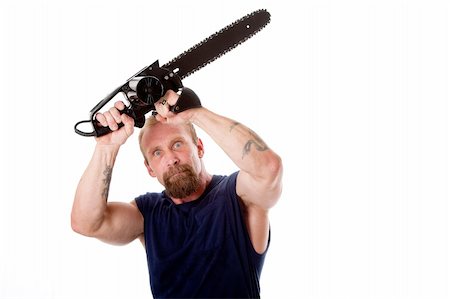 Crazy Caucasian man with tattoos and chainsaw above his head with strong expression in eyes, isolated. Stock Photo - Budget Royalty-Free & Subscription, Code: 400-04634543