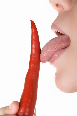 simsearch:400-04575822,k - girl close up licking chili pepper  isolated on white Photographie de stock - Aubaine LD & Abonnement, Code: 400-04634789
