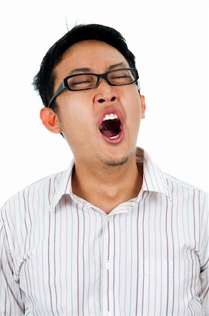 simsearch:400-05089381,k - Tired and unshaved young Asian businessman yawning. Foto de stock - Super Valor sin royalties y Suscripción, Código: 400-04635719