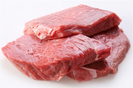 Raw meat on a white background Foto de stock - Royalty-Free Super Valor e Assinatura, Número: 400-04636301