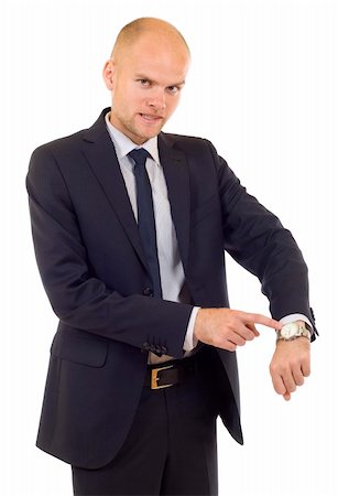 fauchen - Businessman looking at  his watch  isolated on white Stockbilder - Microstock & Abonnement, Bildnummer: 400-04636897