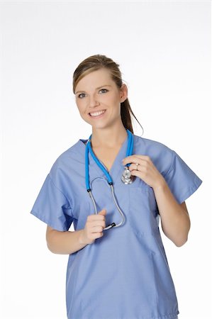 simsearch:400-05172792,k - Beautiful Caucasian doctor or nurse on a white background Foto de stock - Royalty-Free Super Valor e Assinatura, Número: 400-04637129