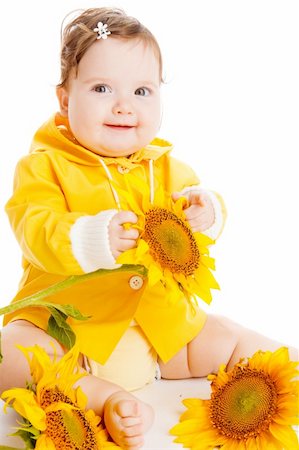 simsearch:400-05130009,k - Cheerful baby girl sitting among sunflowers Stock Photo - Budget Royalty-Free & Subscription, Code: 400-04637390