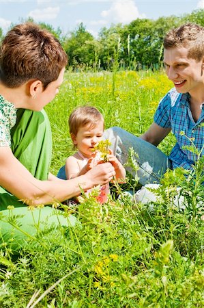 simsearch:400-07715953,k - Parents playing with their daughter in the meadow Stock Photo - Budget Royalty-Free & Subscription, Code: 400-04637411