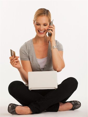 simsearch:400-04130596,k - young woman shopping online with credit card on white seamless background Stock Photo - Budget Royalty-Free & Subscription, Code: 400-04638089