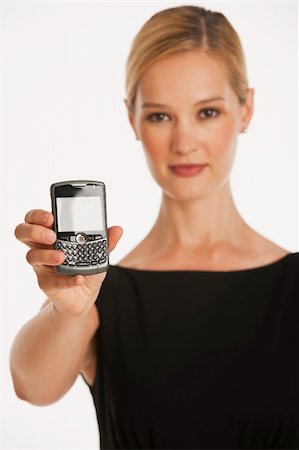 simsearch:400-04204809,k - business woman holding up phone with glowing white screen for copy space and selective focus Stock Photo - Budget Royalty-Free & Subscription, Code: 400-04638104