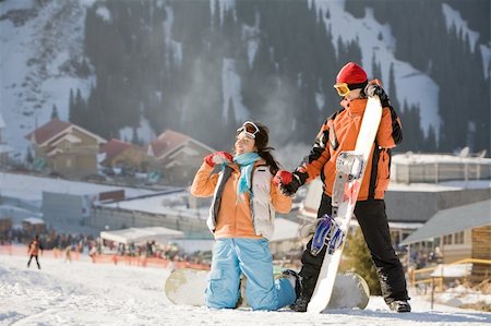 extreme cold clothes women - Lucky couple  snowboarders  in a mountain valley Stock Photo - Budget Royalty-Free & Subscription, Code: 400-04638209