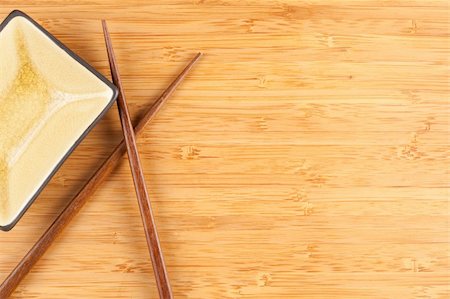 Bamboo Textured Surface Background with Chop Sticks and Bowl and Plenty of Room For Text. Stock Photo - Budget Royalty-Free & Subscription, Code: 400-04638423