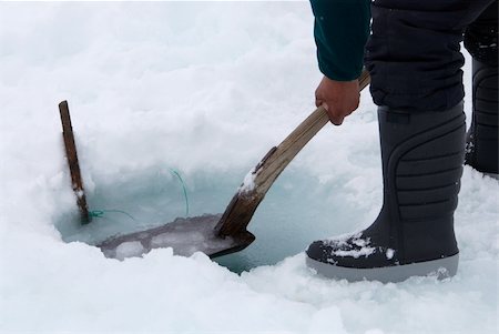 pulling yarn - Inuit hunter removing ice with a shovel Stock Photo - Budget Royalty-Free & Subscription, Code: 400-04638550