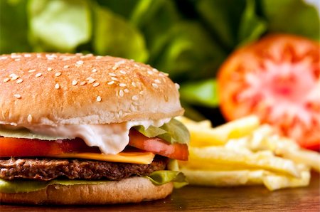 Cheeseburger with lettuce tomato and mayo Stock Photo - Budget Royalty-Free & Subscription, Code: 400-04638711