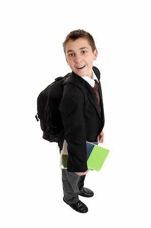 High school student carrying school bag backpack and text books.  He is in uniform, standing sideways and looking around . Stock Photo - Budget Royalty-Free & Subscription, Code: 400-04638897