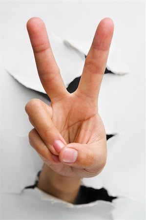 simsearch:400-04639602,k - Peace or number two hand sign came from cracked wall - one of the breakthrough series Stock Photo - Budget Royalty-Free & Subscription, Code: 400-04639547
