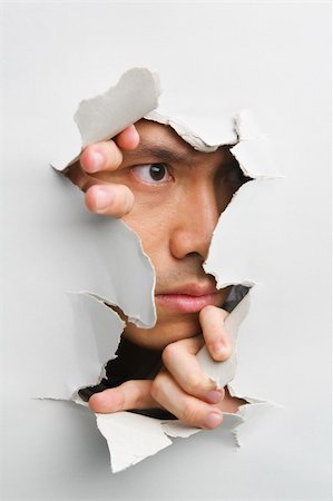 Man looking away from cracked wall - one of the breakthrough series Stock Photo - Budget Royalty-Free & Subscription, Code: 400-04639551