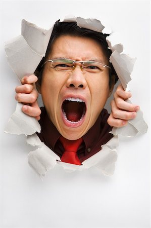 Man screaming from the hole in wall Stock Photo - Budget Royalty-Free & Subscription, Code: 400-04639591