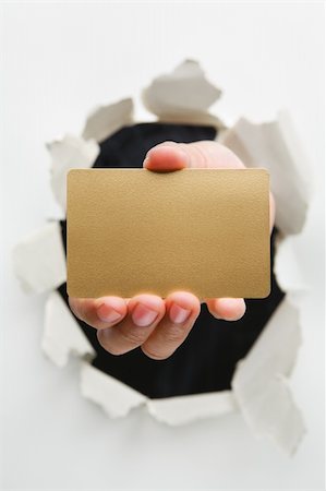 simsearch:400-04639602,k - Hand breakthrough wall holding empty golden card - one of the breakthrough series Stock Photo - Budget Royalty-Free & Subscription, Code: 400-04639604