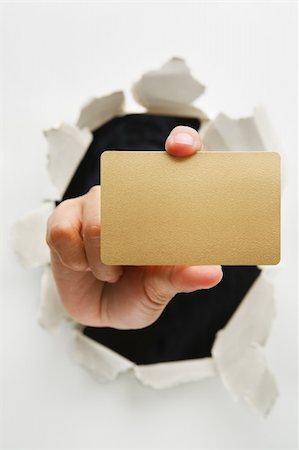 simsearch:400-04639602,k - Hand breakthrough wall holding empty golden card - one of the breakthrough series Stock Photo - Budget Royalty-Free & Subscription, Code: 400-04639606
