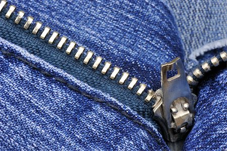 Close-up picture of denim trousers with an open zipper Stock Photo - Budget Royalty-Free & Subscription, Code: 400-04639842