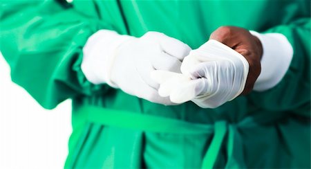 rubber nurse - Senior Surgeon putting on his gloves before surgery Stock Photo - Budget Royalty-Free & Subscription, Code: 400-04630021