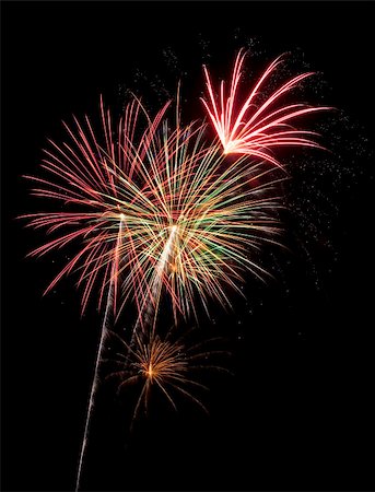 simsearch:400-07093371,k - Beautiful fireworks fill the night time sky Fotografie stock - Microstock e Abbonamento, Codice: 400-04630179