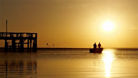 simsearch:400-07486187,k - Jetty silhouette against the morning light reflections Foto de stock - Royalty-Free Super Valor e Assinatura, Número: 400-04630403