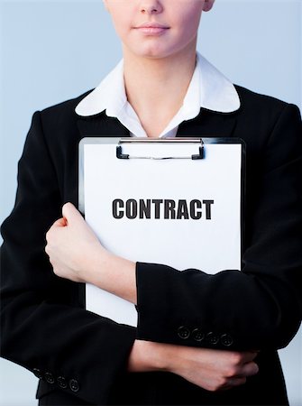 simsearch:400-05895521,k - Young Woman holding a contract on a clipboard Stock Photo - Budget Royalty-Free & Subscription, Code: 400-04630885