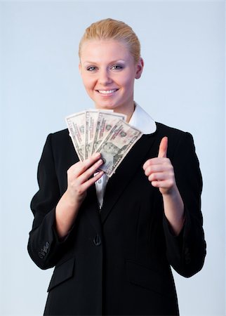 simsearch:400-05156727,k - woman holding dollars with thumb up and camera focus on the person Foto de stock - Super Valor sin royalties y Suscripción, Código: 400-04630889