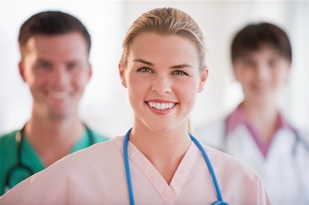 A group of doctors are smiling at the camera.  Horizontally framed shot. Stock Photo - Budget Royalty-Free & Subscription, Code: 400-04631101