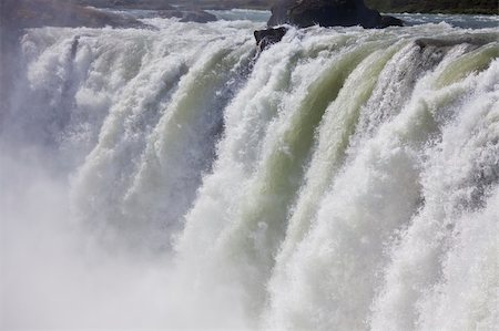 Close up of glacial melt water going over Godafoss Waterfall in Iceland Stockbilder - Microstock & Abonnement, Bildnummer: 400-04631358