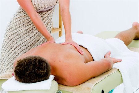 shiatsu - A nice looking man receiving a well deserved spa treatment Foto de stock - Super Valor sin royalties y Suscripción, Código: 400-04631404