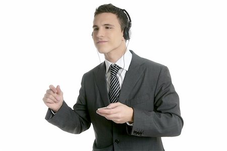 Handsome businessman dancing hearing music with headphones Stock Photo - Budget Royalty-Free & Subscription, Code: 400-04631526