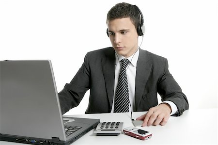 simsearch:400-04124882,k - Businessman with headphones and laptop hearing mp3 music Stock Photo - Budget Royalty-Free & Subscription, Code: 400-04631562