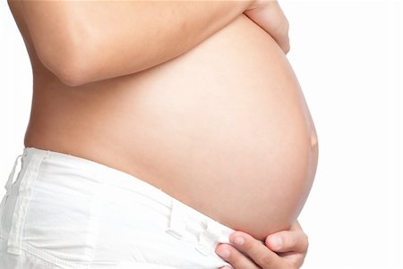 simsearch:400-05162649,k - Pregnant Woman Belly with a White background Foto de stock - Royalty-Free Super Valor e Assinatura, Número: 400-04631589