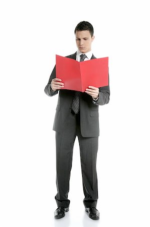 simsearch:400-04963726,k - Full body businessman reading red folder isolated on white at studio Stock Photo - Budget Royalty-Free & Subscription, Code: 400-04631798