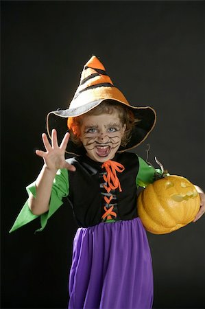 Toddler beautiful witch girl wearing halloween costume and make up Stock Photo - Budget Royalty-Free & Subscription, Code: 400-04631890