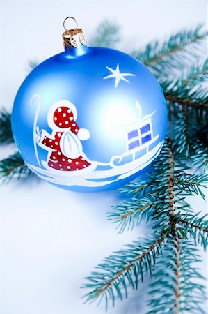 round ornament hanging of a tree - Blue Christmas bauble with ornament of Santa Claus Stock Photo - Budget Royalty-Free & Subscription, Code: 400-04632127