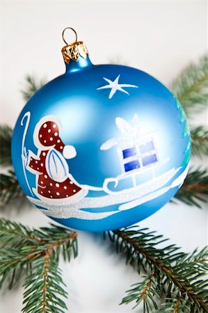 round ornament hanging of a tree - Blue Christmas bauble with ornament of Santa Claus Stock Photo - Budget Royalty-Free & Subscription, Code: 400-04632143