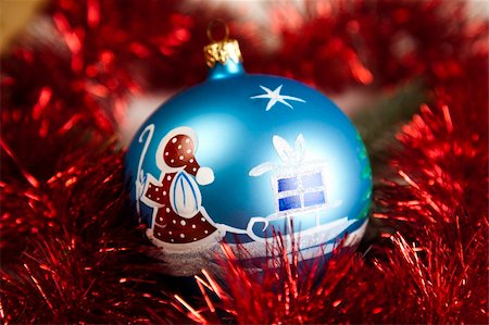 round ornament hanging of a tree - Blue Christmas bauble with ornament of Santa Claus Stock Photo - Budget Royalty-Free & Subscription, Code: 400-04632152