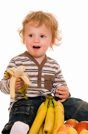 simsearch:640-05760987,k - Baby with fruit isolated on white. Photographie de stock - Aubaine LD & Abonnement, Code: 400-04632911