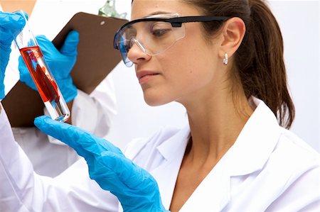 A female scientist working in a Lab with a test tube Stock Photo - Budget Royalty-Free & Subscription, Code: 400-04633110