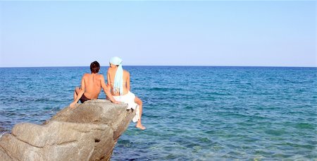 Young beautiful couple watching the sea Foto de stock - Royalty-Free Super Valor e Assinatura, Número: 400-04633312