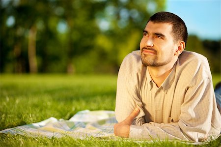 Young attractive man dreaming on a meadow Foto de stock - Royalty-Free Super Valor e Assinatura, Número: 400-04633373